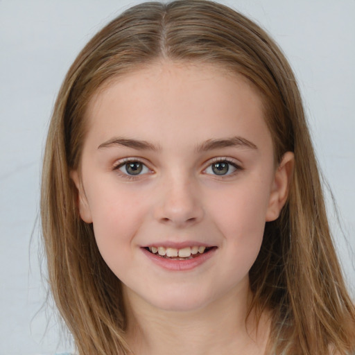 Joyful white child female with long  brown hair and brown eyes