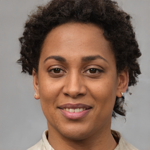 Joyful white adult female with short  brown hair and brown eyes