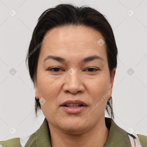 Joyful white adult female with medium  brown hair and brown eyes