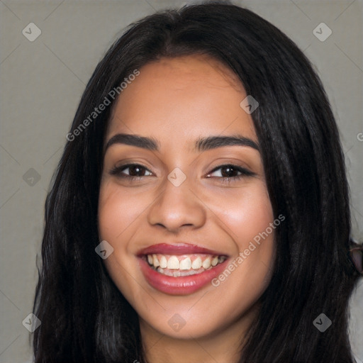 Joyful latino young-adult female with long  black hair and brown eyes