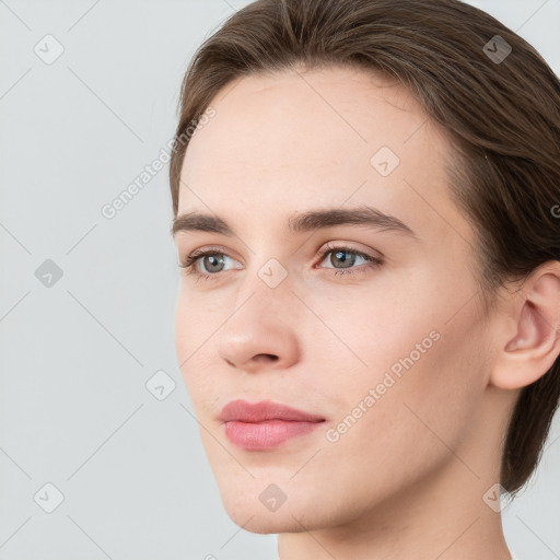 Neutral white young-adult female with short  brown hair and grey eyes