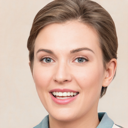 Joyful white young-adult female with medium  brown hair and blue eyes