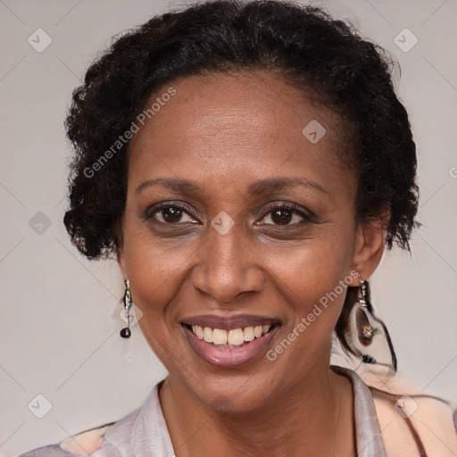 Joyful black adult female with medium  brown hair and brown eyes