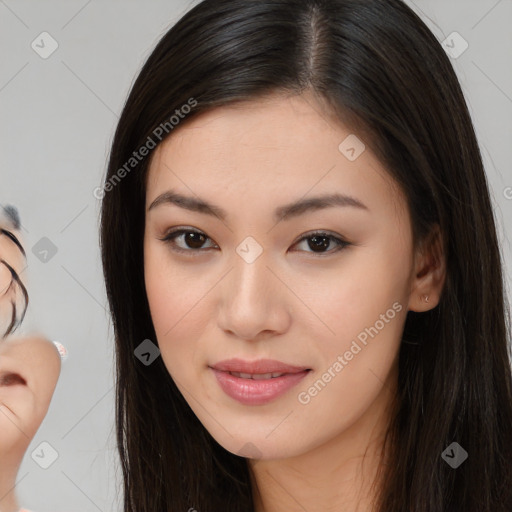 Joyful asian young-adult female with long  brown hair and brown eyes