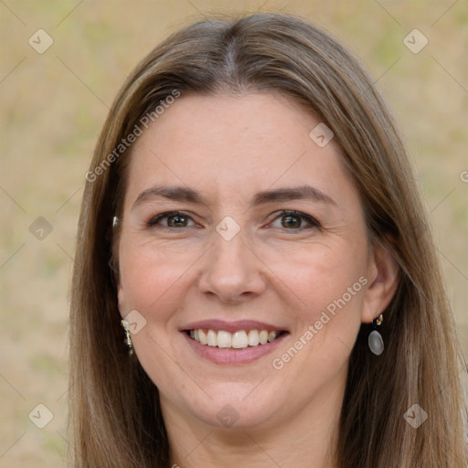 Joyful white adult female with long  brown hair and grey eyes