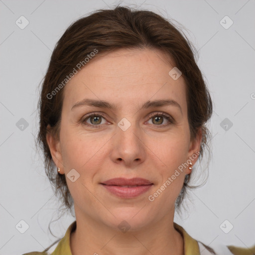 Joyful white adult female with medium  brown hair and grey eyes