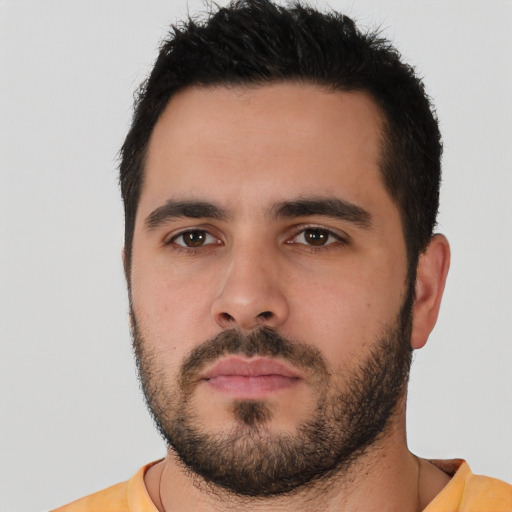 Neutral white young-adult male with short  black hair and brown eyes