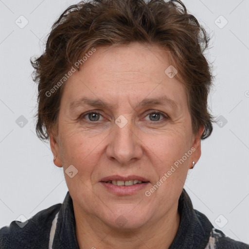 Joyful white adult female with short  brown hair and grey eyes