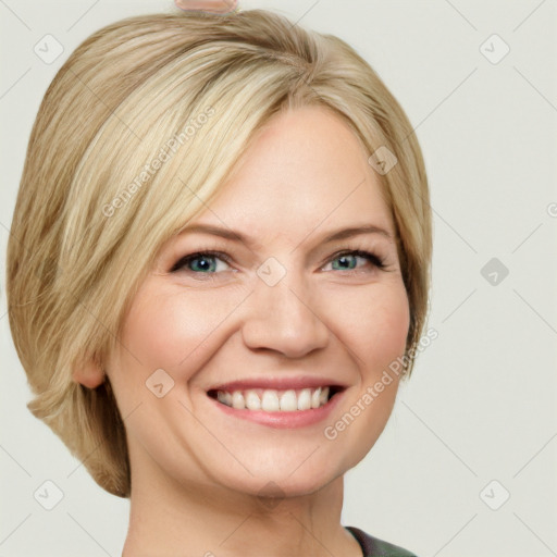 Joyful white adult female with medium  brown hair and green eyes