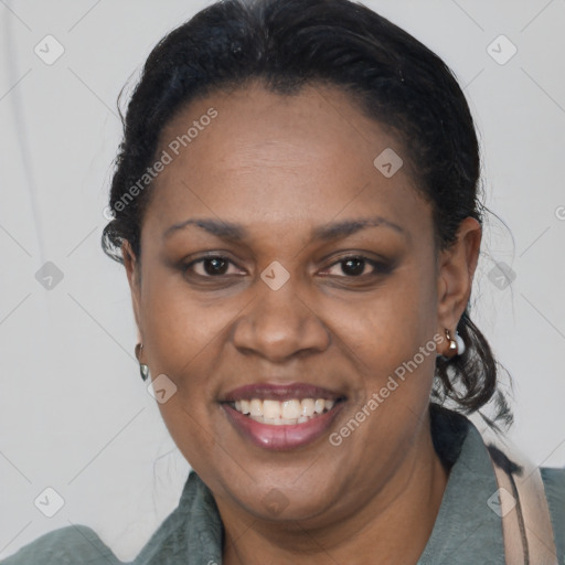 Joyful black adult female with short  black hair and brown eyes