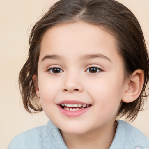 Joyful white child female with medium  brown hair and brown eyes