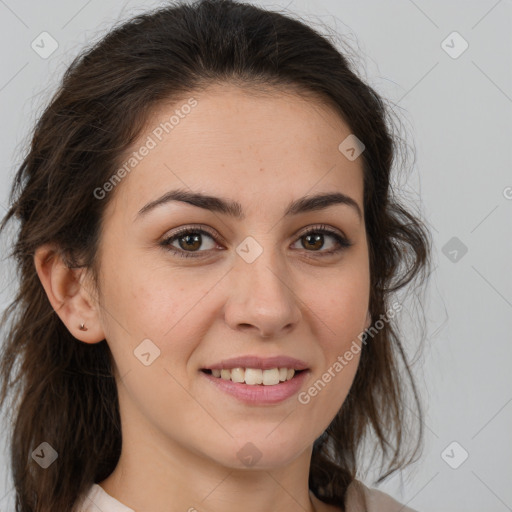 Joyful white young-adult female with long  brown hair and brown eyes