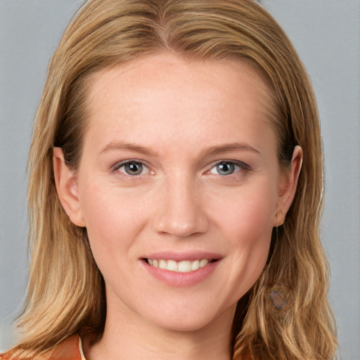 Joyful white young-adult female with long  brown hair and grey eyes