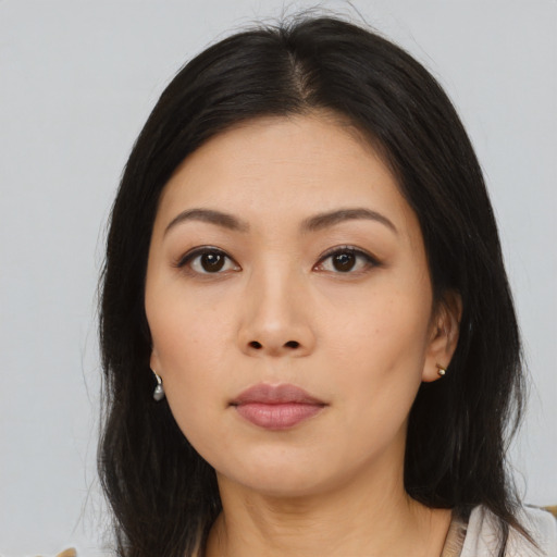 Neutral asian young-adult female with medium  black hair and brown eyes