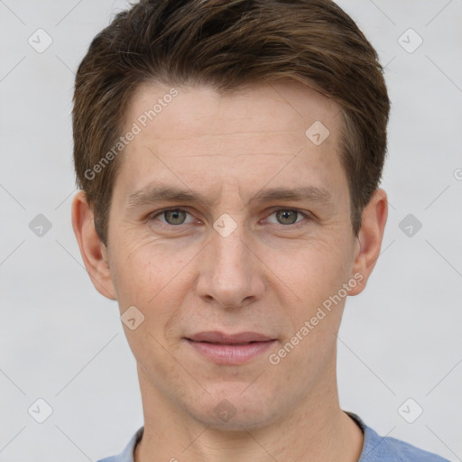 Joyful white adult male with short  brown hair and grey eyes