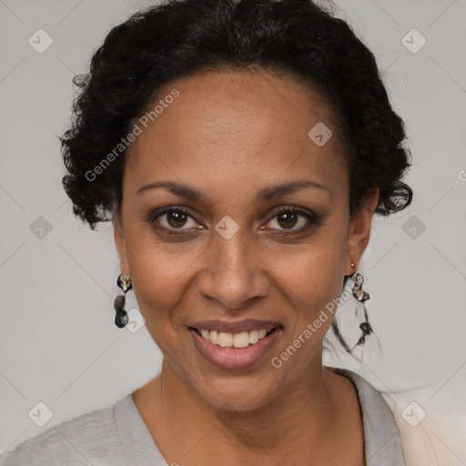 Joyful black adult female with short  brown hair and brown eyes