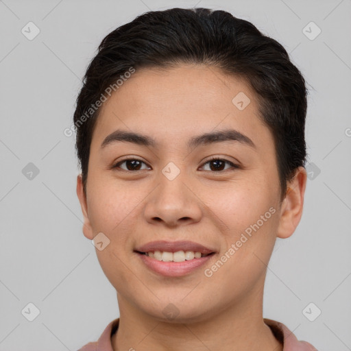 Joyful asian young-adult female with short  brown hair and brown eyes