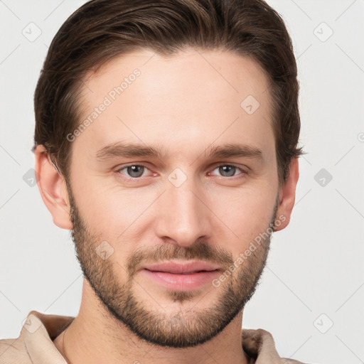 Joyful white young-adult male with short  brown hair and grey eyes