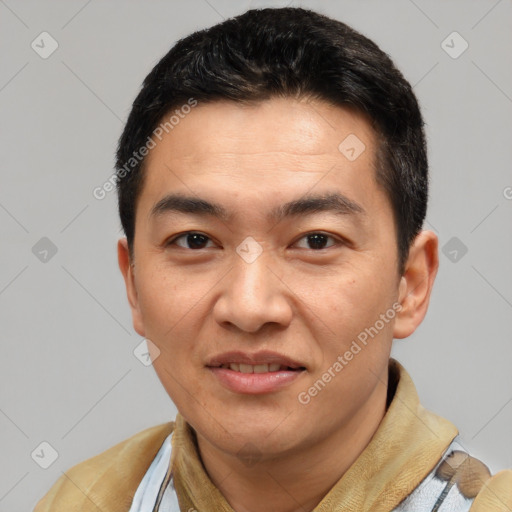 Joyful white young-adult male with short  black hair and brown eyes