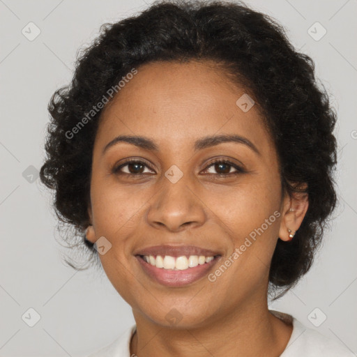 Joyful black young-adult female with long  brown hair and brown eyes