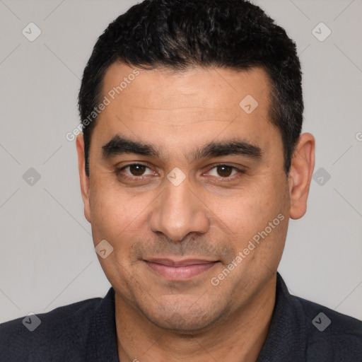 Joyful white young-adult male with short  black hair and brown eyes