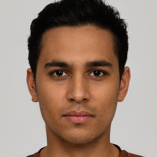 Neutral latino young-adult male with short  brown hair and brown eyes