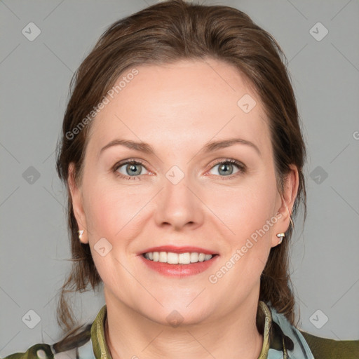 Joyful white young-adult female with medium  brown hair and blue eyes