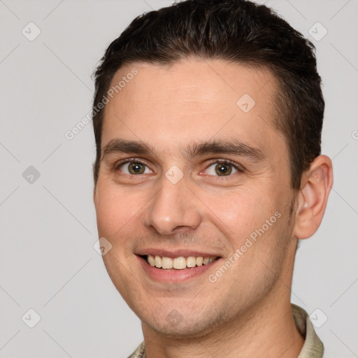 Joyful white young-adult male with short  brown hair and brown eyes