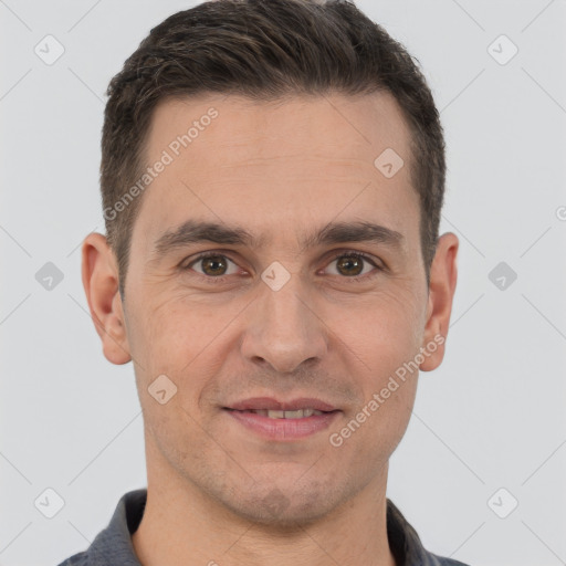 Joyful white adult male with short  brown hair and brown eyes