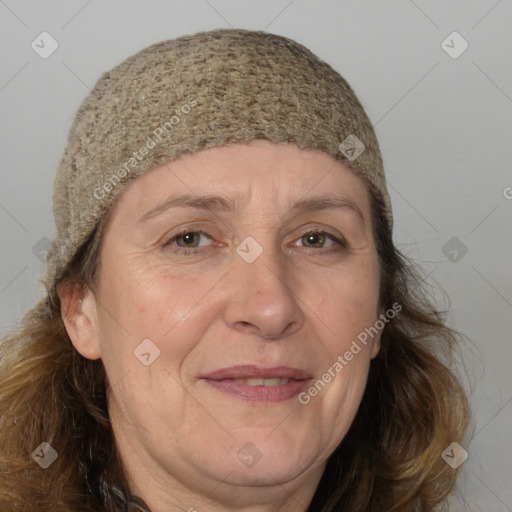 Joyful white adult female with medium  brown hair and brown eyes