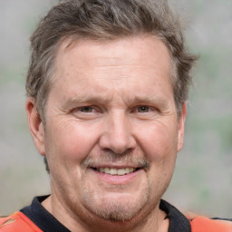 Joyful white adult male with short  brown hair and grey eyes