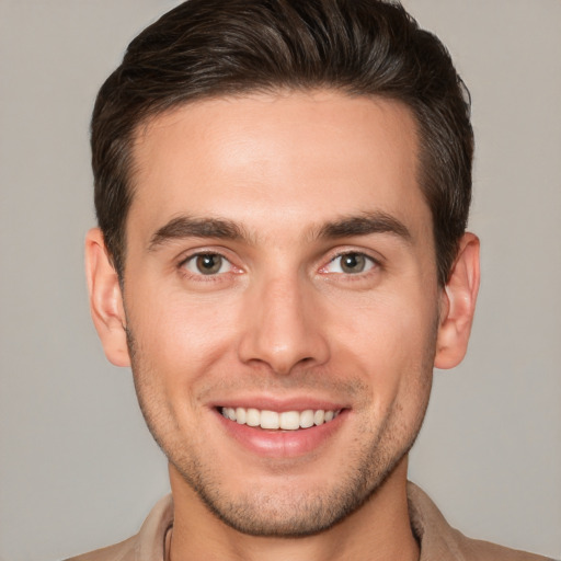 Joyful white young-adult male with short  brown hair and brown eyes