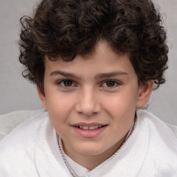 Joyful white child male with short  brown hair and brown eyes