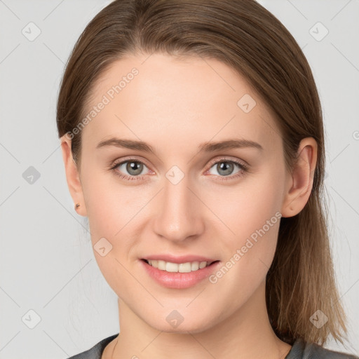 Joyful white young-adult female with long  brown hair and grey eyes