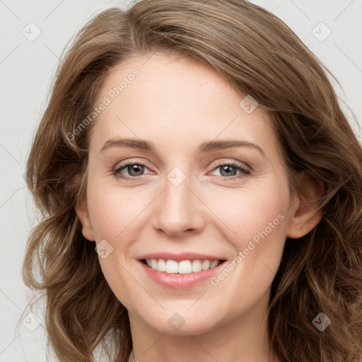 Joyful white young-adult female with long  brown hair and green eyes