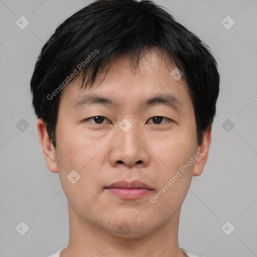 Neutral asian young-adult male with short  brown hair and brown eyes