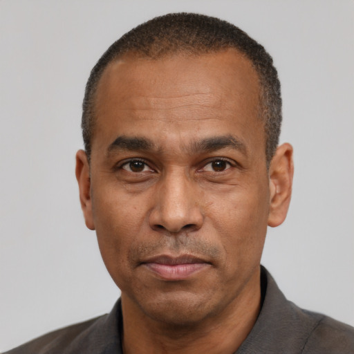 Neutral latino adult male with short  black hair and brown eyes
