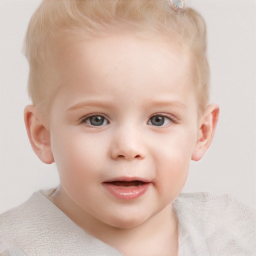 Joyful white child male with short  blond hair and blue eyes