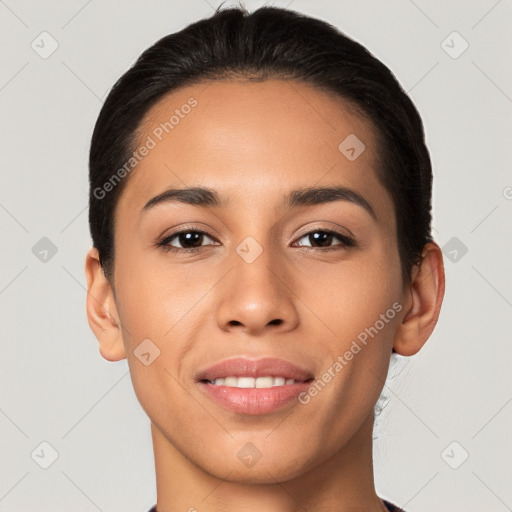 Joyful latino young-adult female with short  black hair and brown eyes