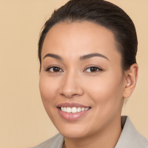 Joyful white young-adult female with medium  brown hair and brown eyes