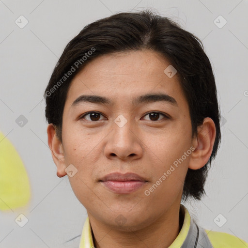 Joyful asian young-adult male with short  brown hair and brown eyes