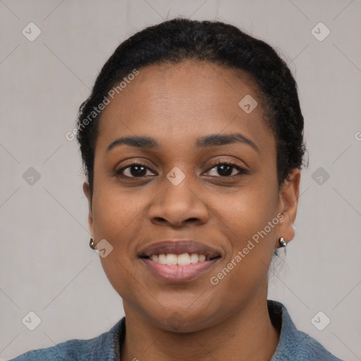 Joyful latino young-adult female with short  black hair and brown eyes