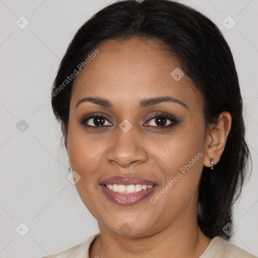 Joyful black young-adult female with medium  brown hair and brown eyes