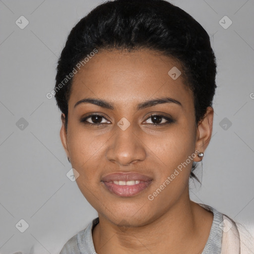 Joyful black young-adult female with short  black hair and brown eyes