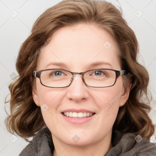 Joyful white adult female with medium  brown hair and blue eyes