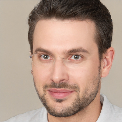 Joyful white adult male with short  brown hair and brown eyes