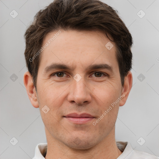 Joyful white adult male with short  brown hair and brown eyes