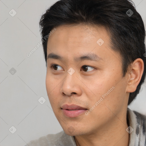 Neutral asian young-adult male with short  brown hair and brown eyes