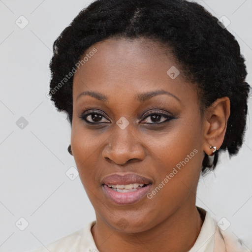 Joyful black young-adult female with short  brown hair and brown eyes