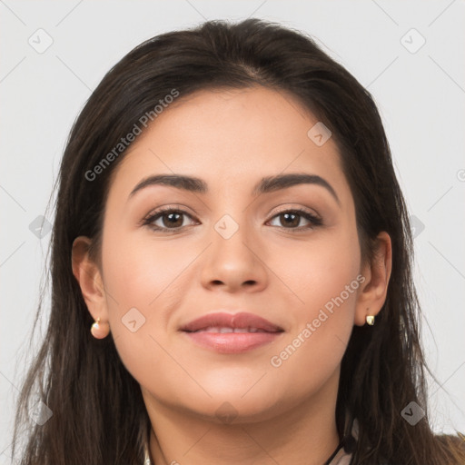 Joyful latino young-adult female with long  brown hair and brown eyes